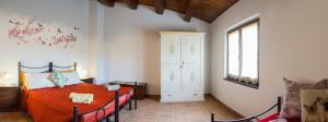 A bed or beds in a room at Il Gladiolo