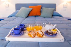 A bed or beds in a room at La Gioiella Capri
