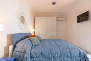 A bed or beds in a room at La Gioiella Capri