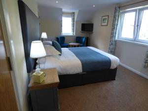 Cama o camas de una habitación en The Brevins Guest House