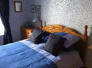 Tempat tidur dalam kamar di Bellegreen