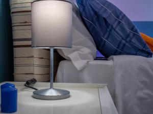 A bed or beds in a room at Appartamento Il canto della Luna