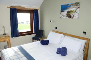 A bed or beds in a room at St Columba Hotel