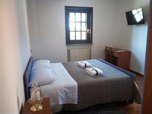 Postel nebo postele na pokoji v ubytování B&B Il Giramondo