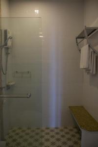 a bathroom with a shower with a glass door at Chill Days @ Koh Larn in Ko Larn