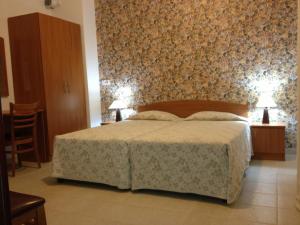 Postel nebo postele na pokoji v ubytování Palates Hotel