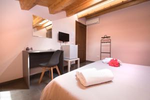 Postel nebo postele na pokoji v ubytování Casa Malaclà B&B