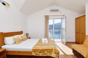 Katil atau katil-katil dalam bilik di Rosic Apartments Baosici