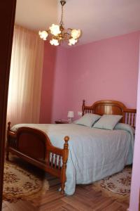 A bed or beds in a room at Casa Dana