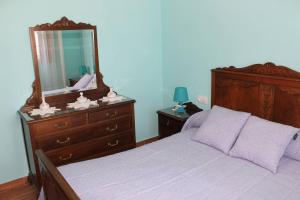 A bed or beds in a room at Casa Dana