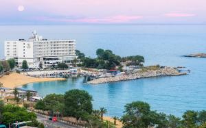 a view of a beach with a large building at Sea Breeze Experience in Kavála