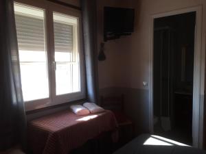 Postel nebo postele na pokoji v ubytování Hotel Le Méditérranée