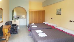 Postel nebo postele na pokoji v ubytování Gardenos Hotel