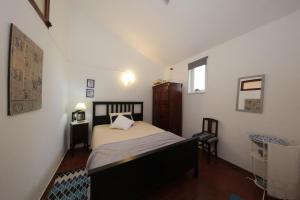 Charming Cottage near Tavira tesisinde bir odada yatak veya yataklar