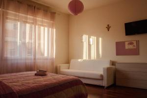 Postel nebo postele na pokoji v ubytování B&B Domus Benedicta