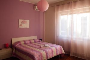 Postel nebo postele na pokoji v ubytování B&B Domus Benedicta