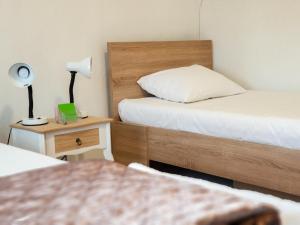 Postel nebo postele na pokoji v ubytování Kulla Dula Guesthouse