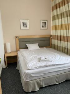 Posteľ alebo postele v izbe v ubytovaní 404 Rooms Wilanowska