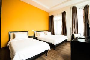 Letto o letti in una camera di Hanoi Buffalo Hostel