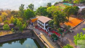 an overhead view of a train station next to a river at Magadh ,In Fort Panhala Hotel in Panhāla