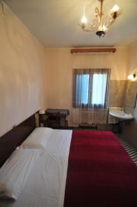 Łóżko lub łóżka w pokoju w obiekcie Locanda Sant'Anna Hotel