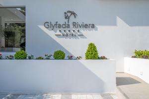 a sign for the gilada riviera hotel at Glyfada Riviera Hotel in Athens