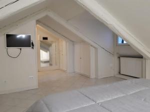 Televízia a/alebo spoločenská miestnosť v ubytovaní Casanova Apartment San Marco
