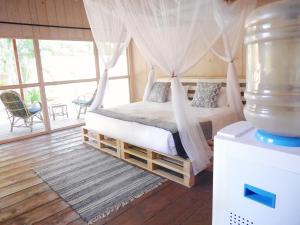Letto o letti in una camera di Palm Forest Palolem