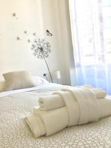 a bedroom with a bed with towels on it at Le Rondini a Roma in Rome