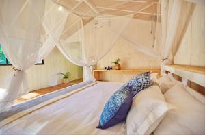 Letto o letti in una camera di Palm Forest Palolem