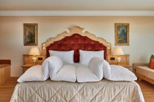 Ένα ή περισσότερα κρεβάτια σε δωμάτιο στο Hotel Sassongher