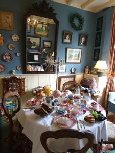 a table topped with plates of food at Deventer Heritage en Boutique B&B museumhuis Huize "De Worp" in Deventer