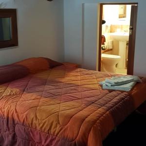 A bed or beds in a room at Affittacamere Luti