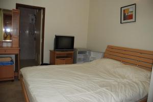 Postel nebo postele na pokoji v ubytování TK Guesthouse