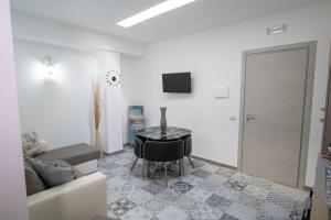 Televízia a/alebo spoločenská miestnosť v ubytovaní La Maison d'Irene