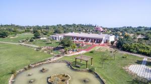 an aerial view of a house with a park at Quinta dos Poetas Nature Hotel & Apartments in Olhão