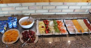 a tray of food with different types of food and drinks at Quinta dos Poetas Nature Hotel & Apartments in Olhão
