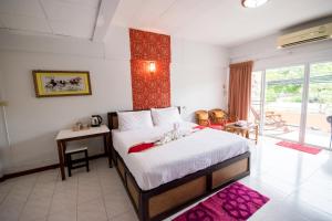 Postel nebo postele na pokoji v ubytování Maria Room HuaHin