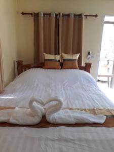 Ένα ή περισσότερα κρεβάτια σε δωμάτιο στο Mae kuawn Resort