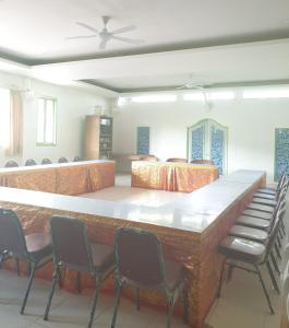 a large conference room with a large table and chairs at At The Beach Candidasa in Candidasa