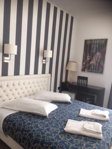 Postel nebo postele na pokoji v ubytování Hotel Centrale