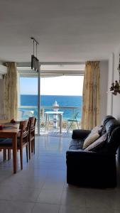 a living room with a view of the ocean at vistas al mar in Torre del Mar