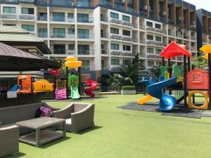 a playground in front of a large building at Laguna Beach Resort 2 in Jomtien Beach +37 photos