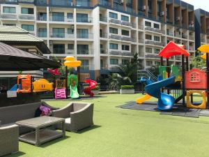 a playground in front of a large building at Laguna Beach Resort 2 in Jomtien Beach