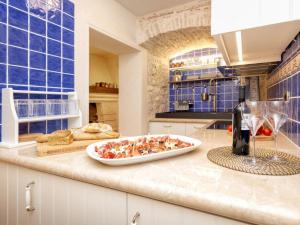 a kitchen with a plate of food on a counter at Villa Varda - Villa Latica in Hvar