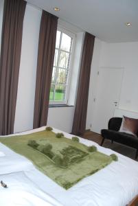 Een bed of bedden in een kamer bij In 't Groen