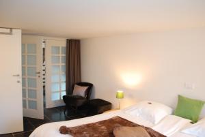 Een bed of bedden in een kamer bij In 't Groen