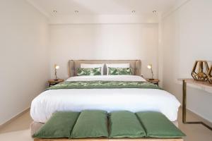 Łóżko lub łóżka w pokoju w obiekcie Fay Boutique Hotel