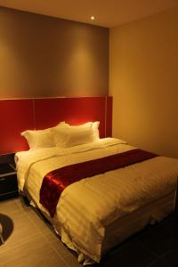 Postel nebo postele na pokoji v ubytování Hotel Eastana Ipoh