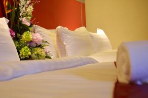 Postel nebo postele na pokoji v ubytování Hotel Eastana Ipoh